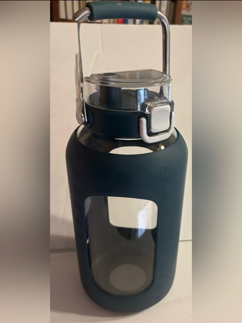 Large Glass Water Bottle +1/2 gal
Blue Silicone Sleeve 
Stainless Steel Handle